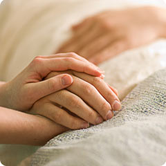 article-hands-hospital-bed